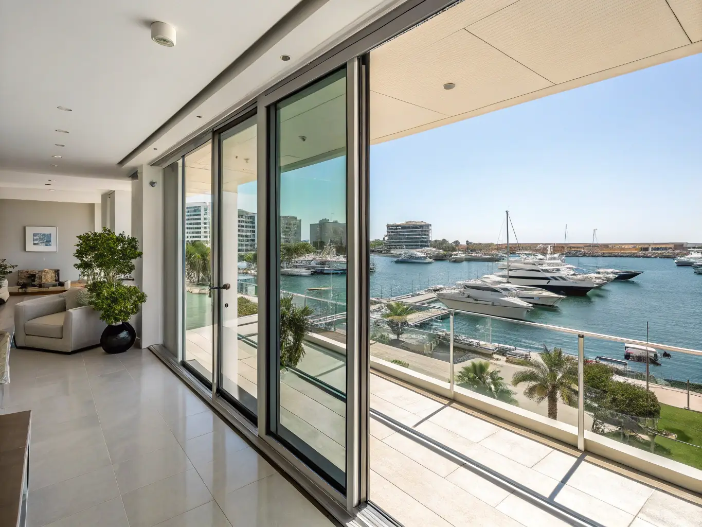 An elegant high-rise condo in Orange Beach, Alabama, offering panoramic harbor views, state-of-the-art amenities, a private balcony, and access to a rooftop terrace.